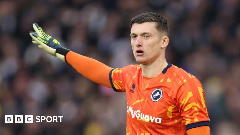 Millwall fans applaud goalkeeper Liam Roberts after red card against Crystal Palace