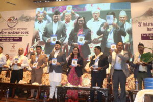 **The Chairperson, Chief Guest and other guests jointly unveiling the FoNIJ Souvenir–2083 during the program.**